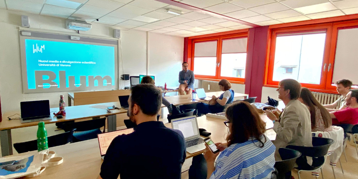 Professors attending a workshop about the dissemination of research, at the desk, Luca Barbieri